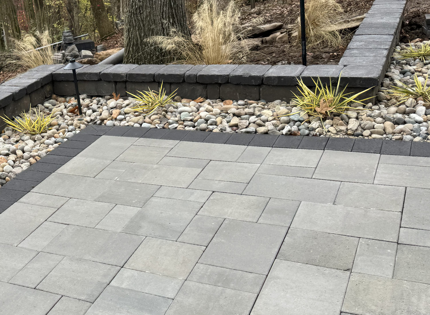 Detailed paver patio with a stacked-stone border
