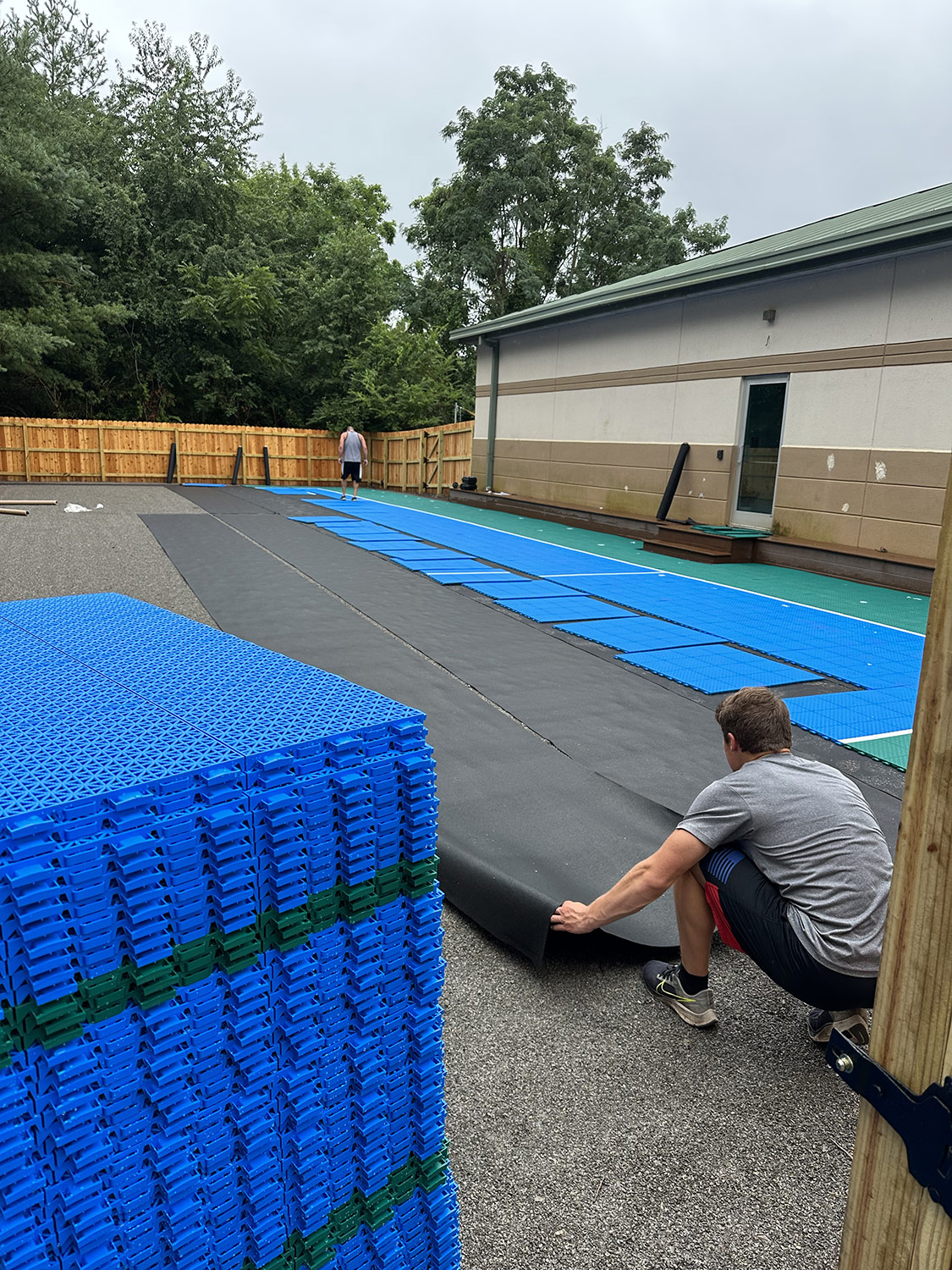 A custom-tiled outdoor sport court installation